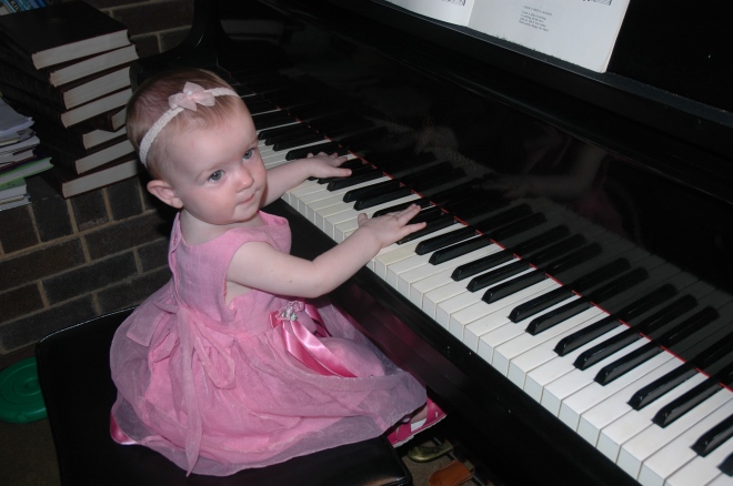 Miss playing my mother's grand piano, aged 1. 